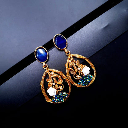 oval-shaped gemstone at the top, followed by a delicate gold frame with decorative swirls, tiny pearls, and a small rose image 8