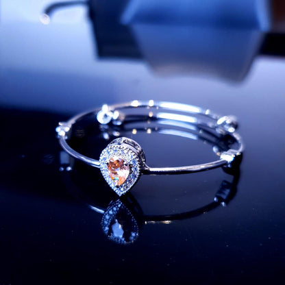 A delicate bracelet featuring a charming design accented with sparkling white stones. image 4