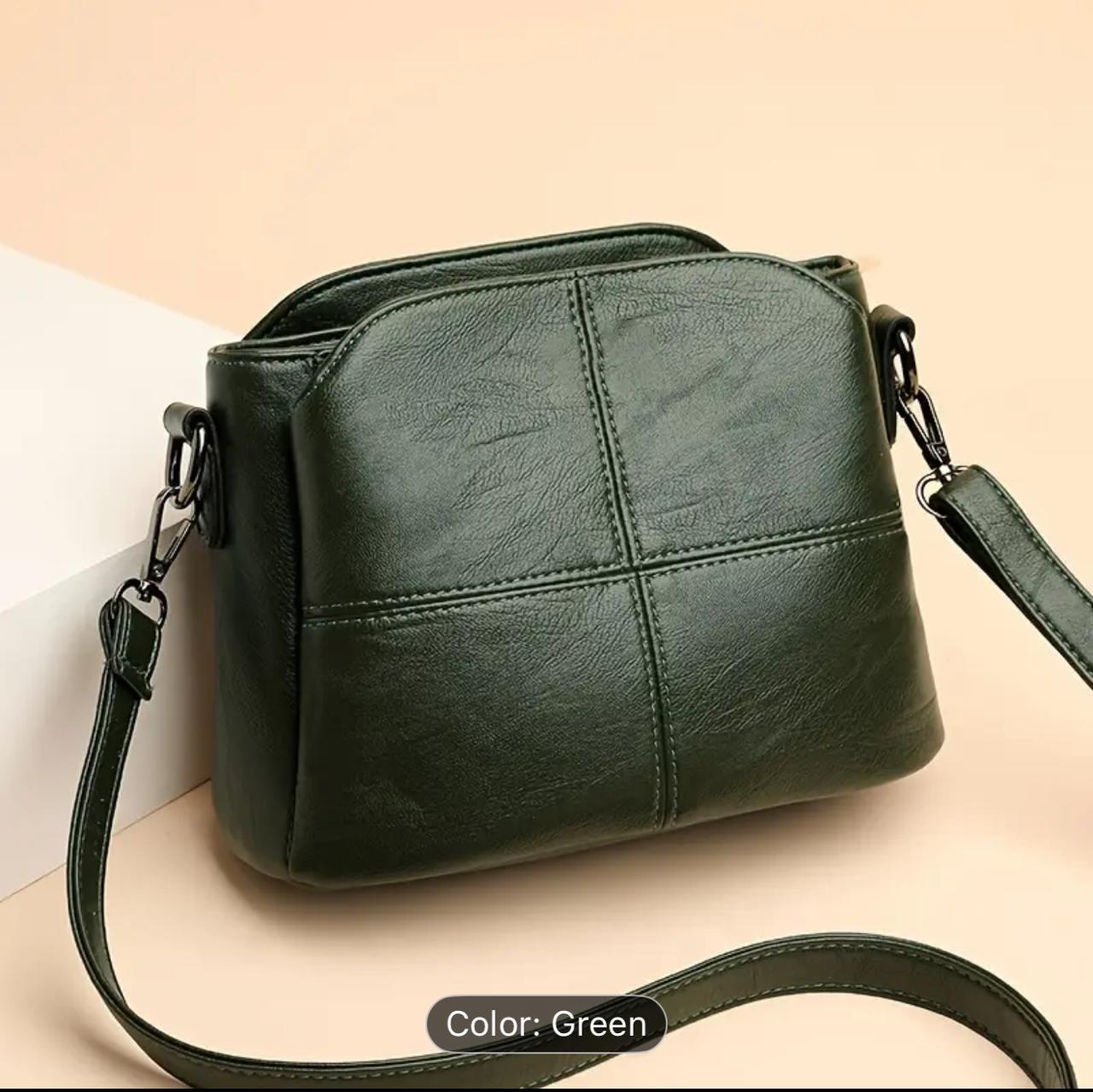 Stylish and functional faux leather bag in a rich olive green. Features a sleek front zip pocket and sturdy hardware — ideal for daily essentials or travel light image 0