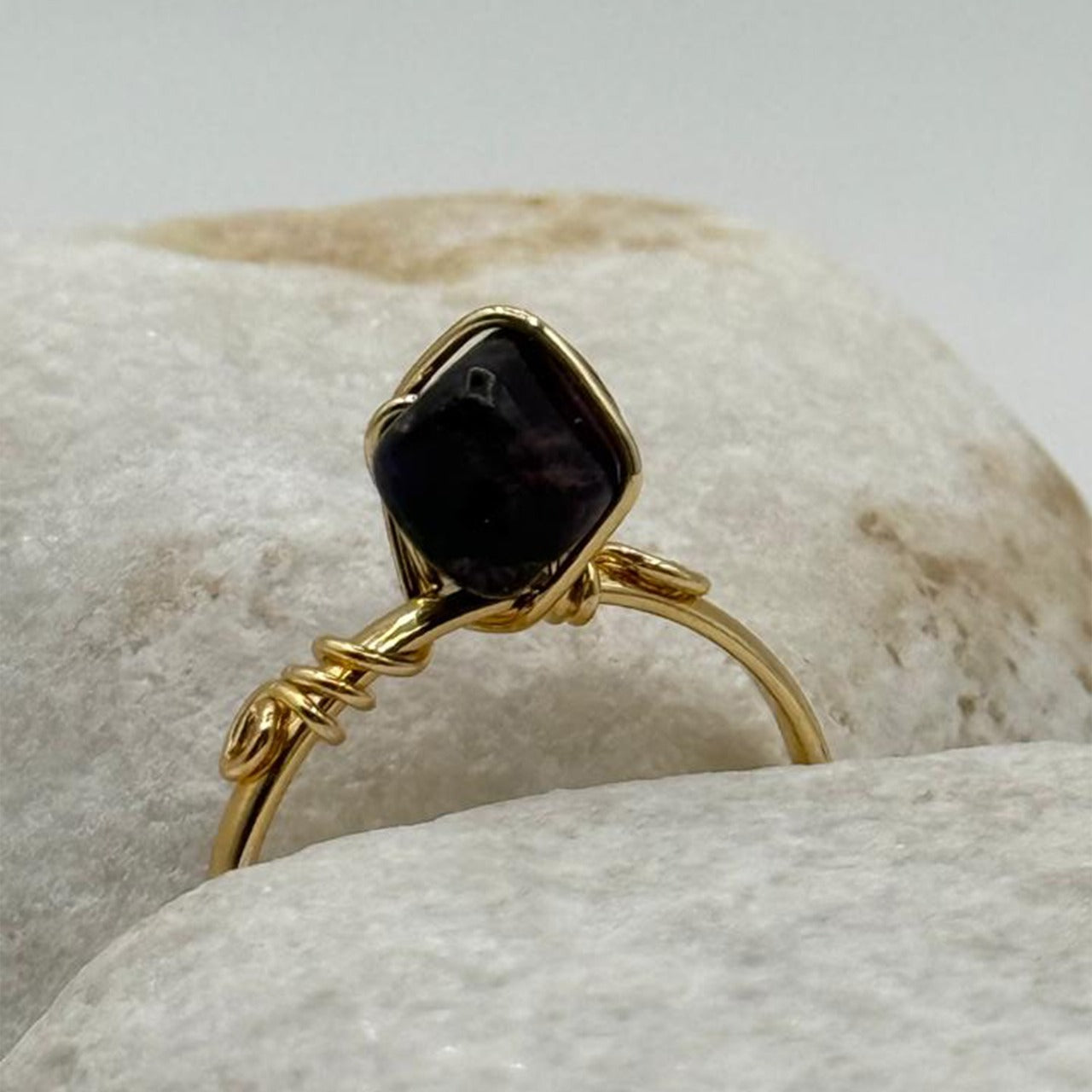handcrafted gold ring with a deep black stone image 2