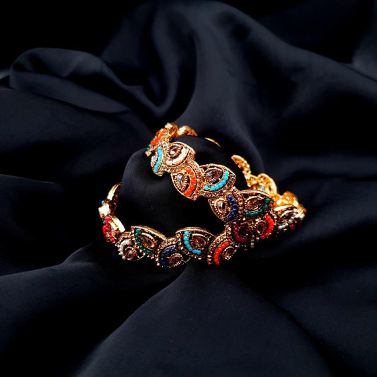 The allure of gemstone accents, these pair of bangles are designed to complement your unique style crafted with intricate details and adorned with a variety of vibrant and elegant hues image 0