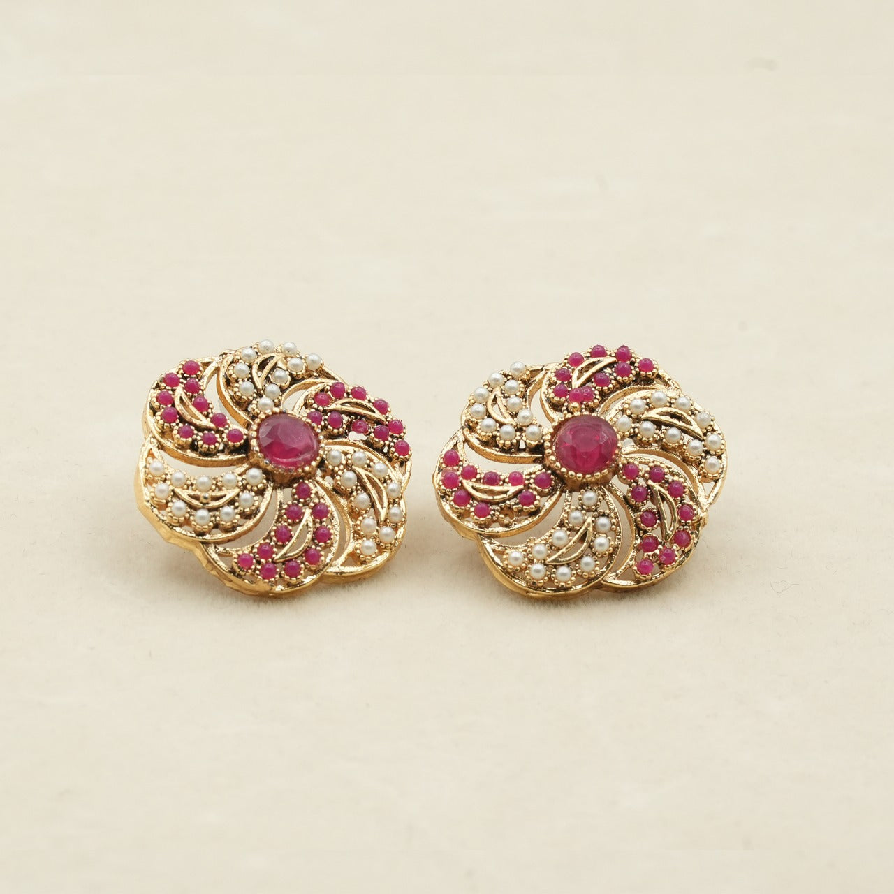 Likely gold-plated metal with a detailed filigree design - Pink image