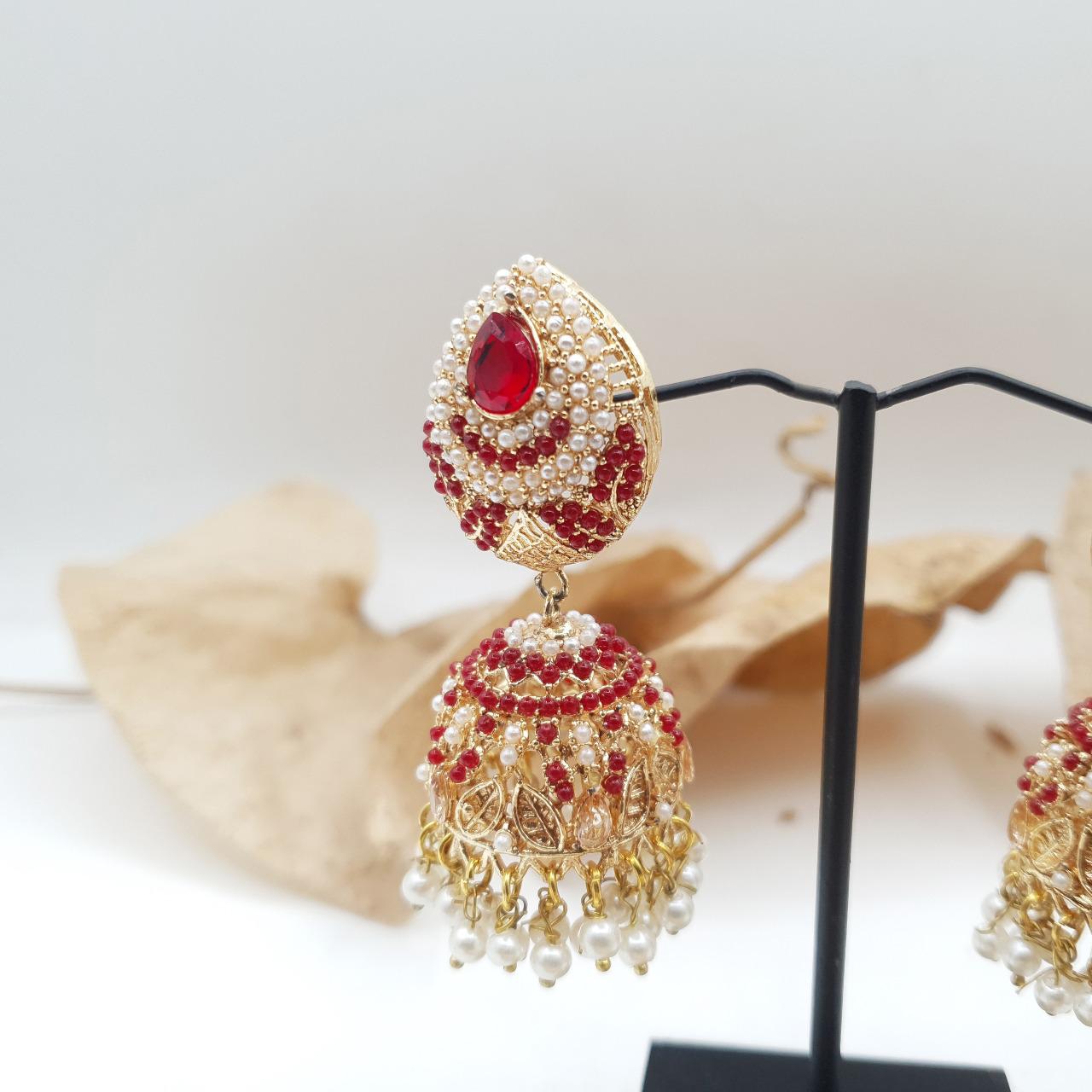 Discover timeless elegance with our Regal Pearldrop Jhumka Collection image 5
