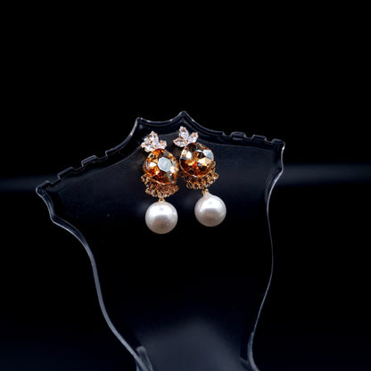 Stunning oval-shaped rhinestone earrings with a graceful pearl for an elegant charm. image 6