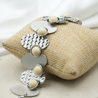 A contemporary mix of oval and circular metal elements in alternating textures image 6