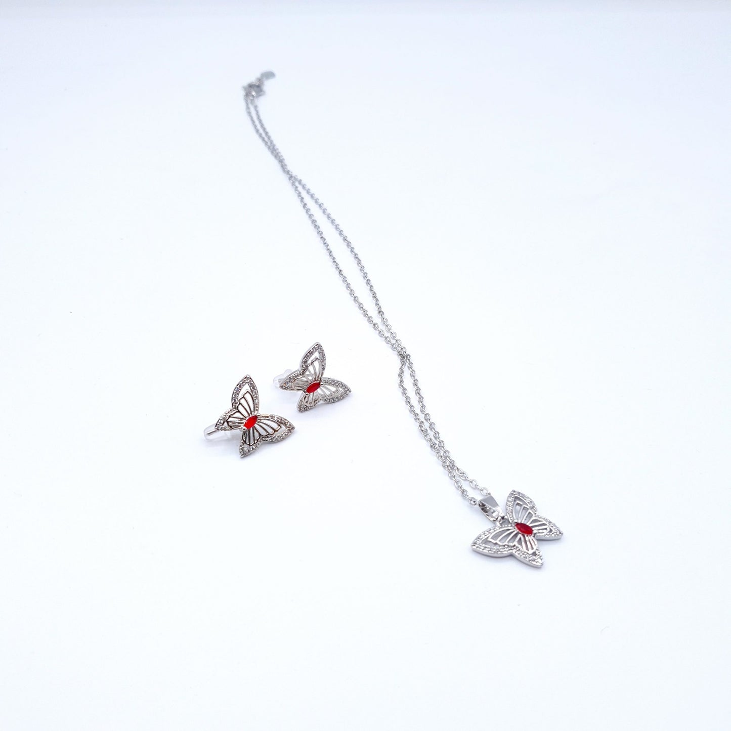 butterfly pendant with a radiant red gem pairs beautifully with matching ear studs image 0