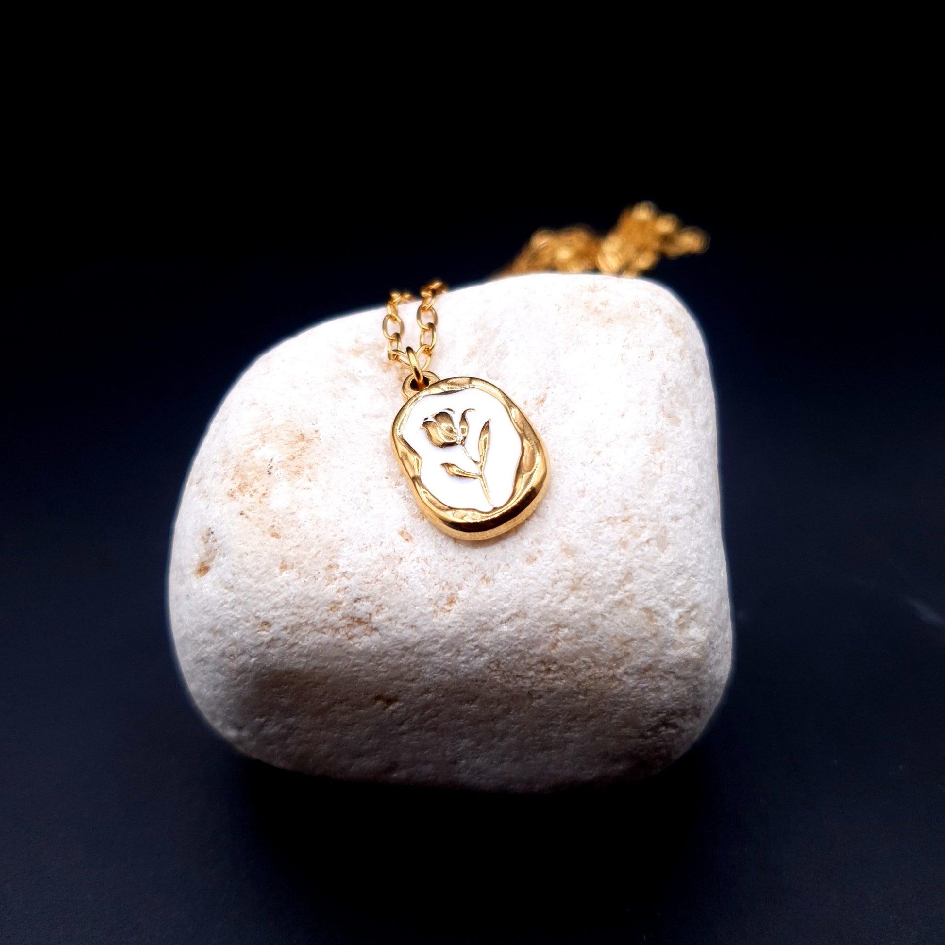 A stunning stainless steel pendant on a golden chain, combining elegance and durability for a timeless look. image 1