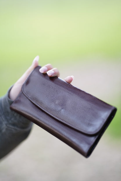 A Stylish and minimalistic genuine leather clutch with a smooth finish and curved flap design, perfect for any occasion image 9