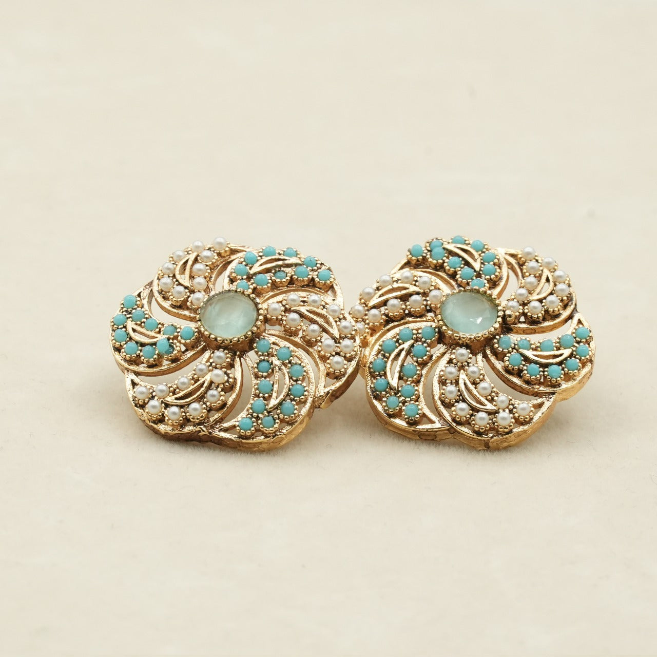 Likely gold-plated metal with a detailed filigree design image 2
