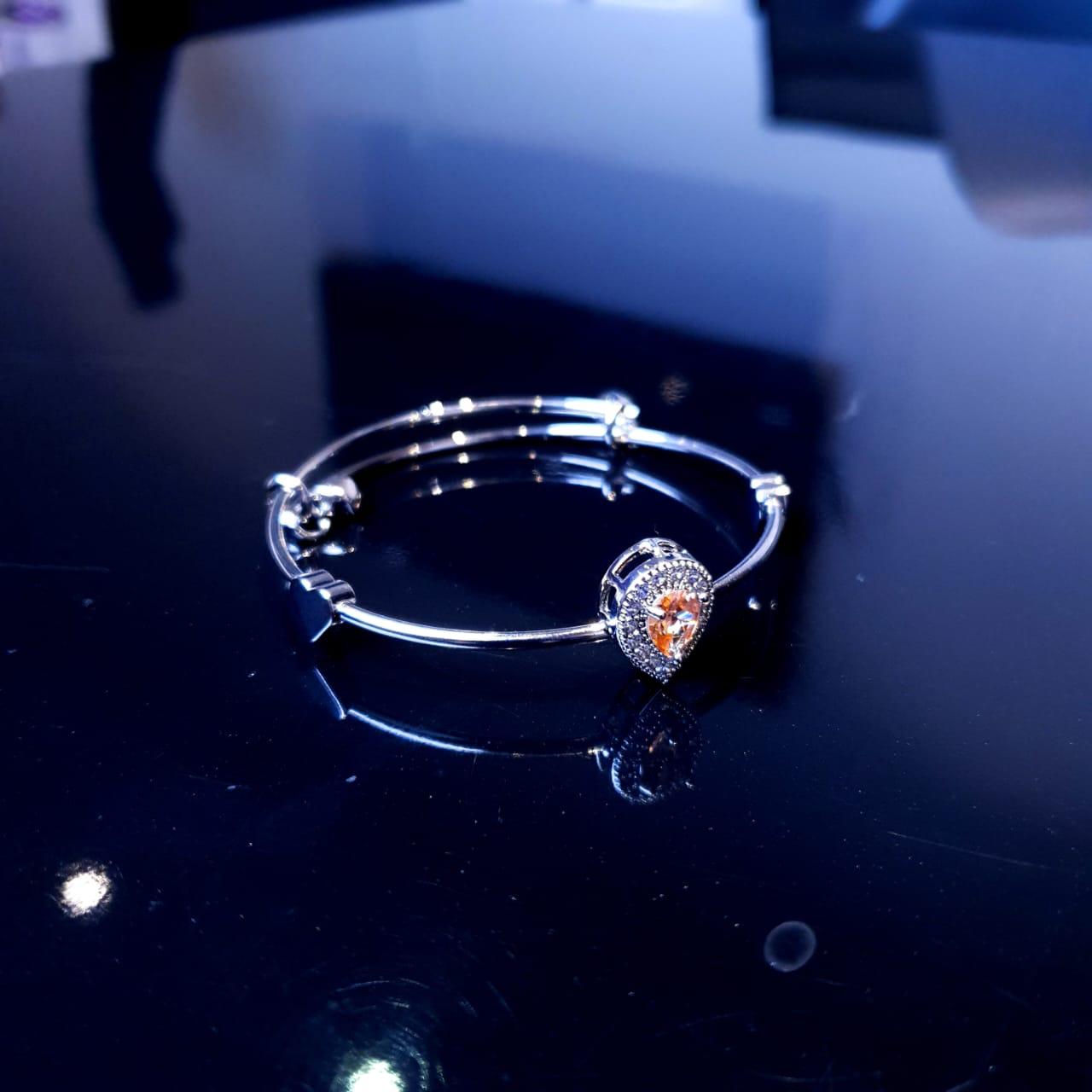 A delicate bracelet featuring a charming design accented with sparkling white stones. image 3