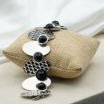 A contemporary mix of oval and circular metal elements in alternating textures image 4