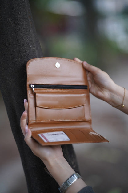 A Stylish and minimalistic genuine leather clutch with a smooth finish and curved flap design, perfect for any occasion image 2