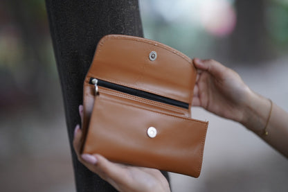 A Stylish and minimalistic genuine leather clutch with a smooth finish and curved flap design, perfect for any occasion image 4