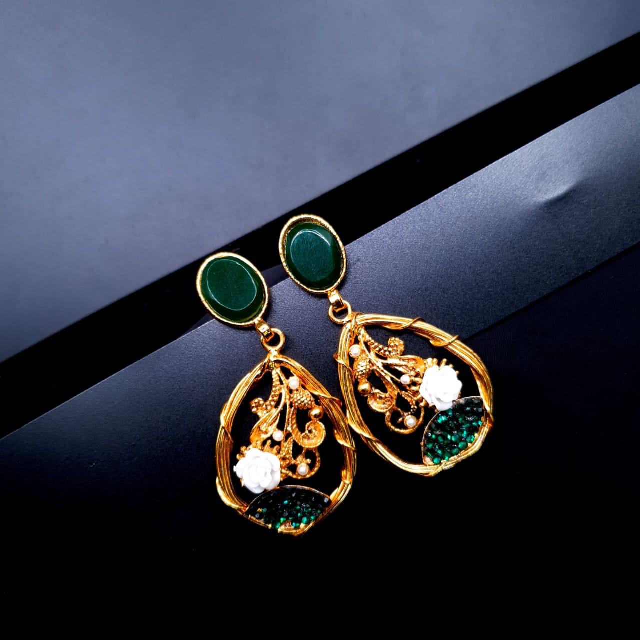 oval-shaped gemstone at the top, followed by a delicate gold frame with decorative swirls, tiny pearls, and a small rose - Green image