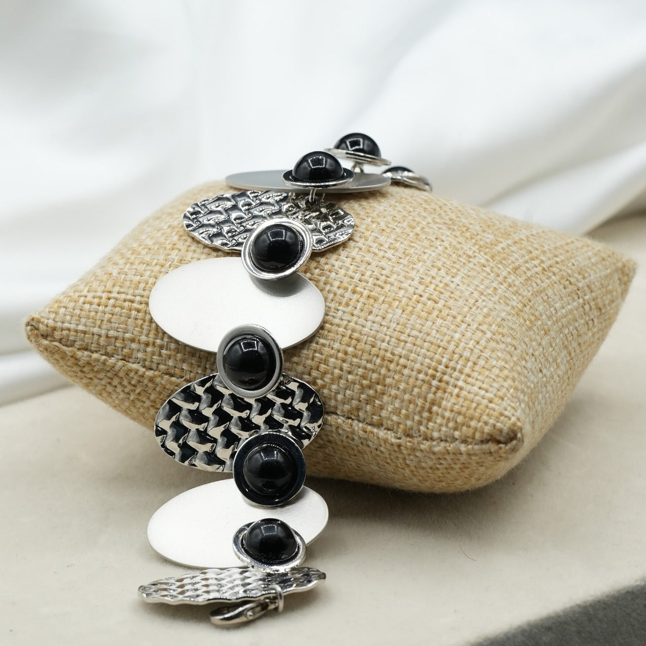 A contemporary mix of oval and circular metal elements in alternating textures image 5
