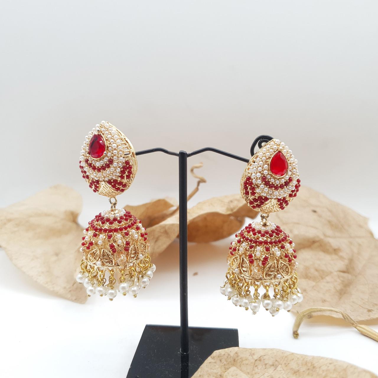 Discover timeless elegance with our Regal Pearldrop Jhumka Collection image 6