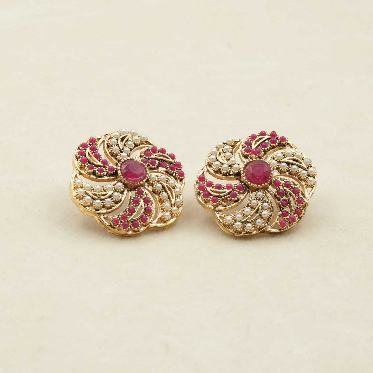 Likely gold-plated metal with a detailed filigree design image 1
