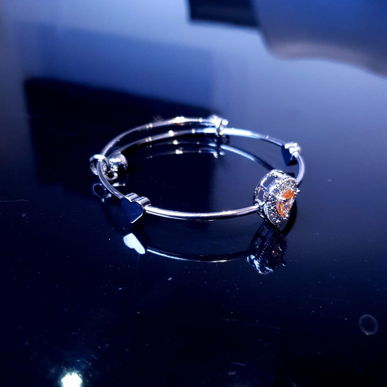 A delicate bracelet featuring a charming design accented with sparkling white stones. image 5