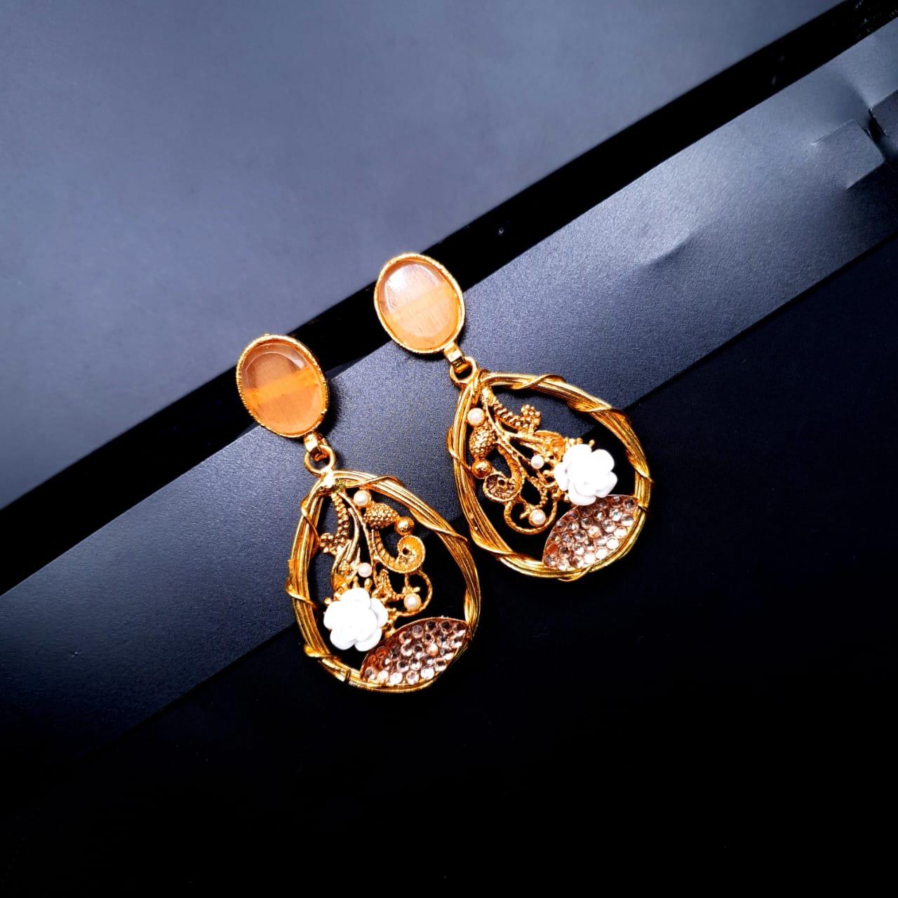 oval-shaped gemstone at the top, followed by a delicate gold frame with decorative swirls, tiny pearls, and a small rose image 5