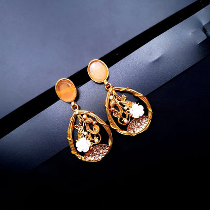 oval-shaped gemstone at the top, followed by a delicate gold frame with decorative swirls, tiny pearls, and a small rose image 5