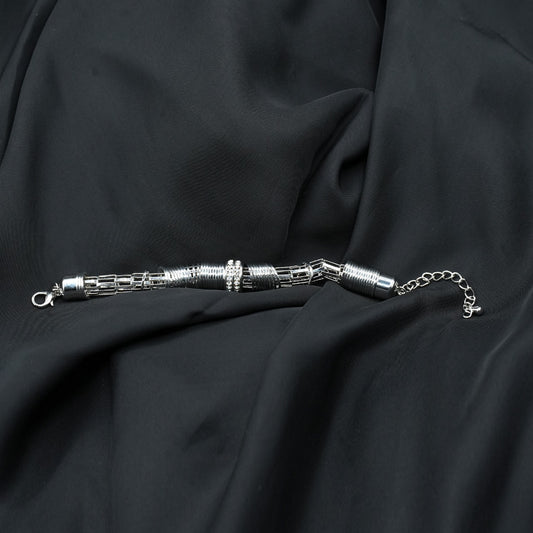 A modern and edgy coiled metal ring structure with a stacked effect, creating depth and texture image 1