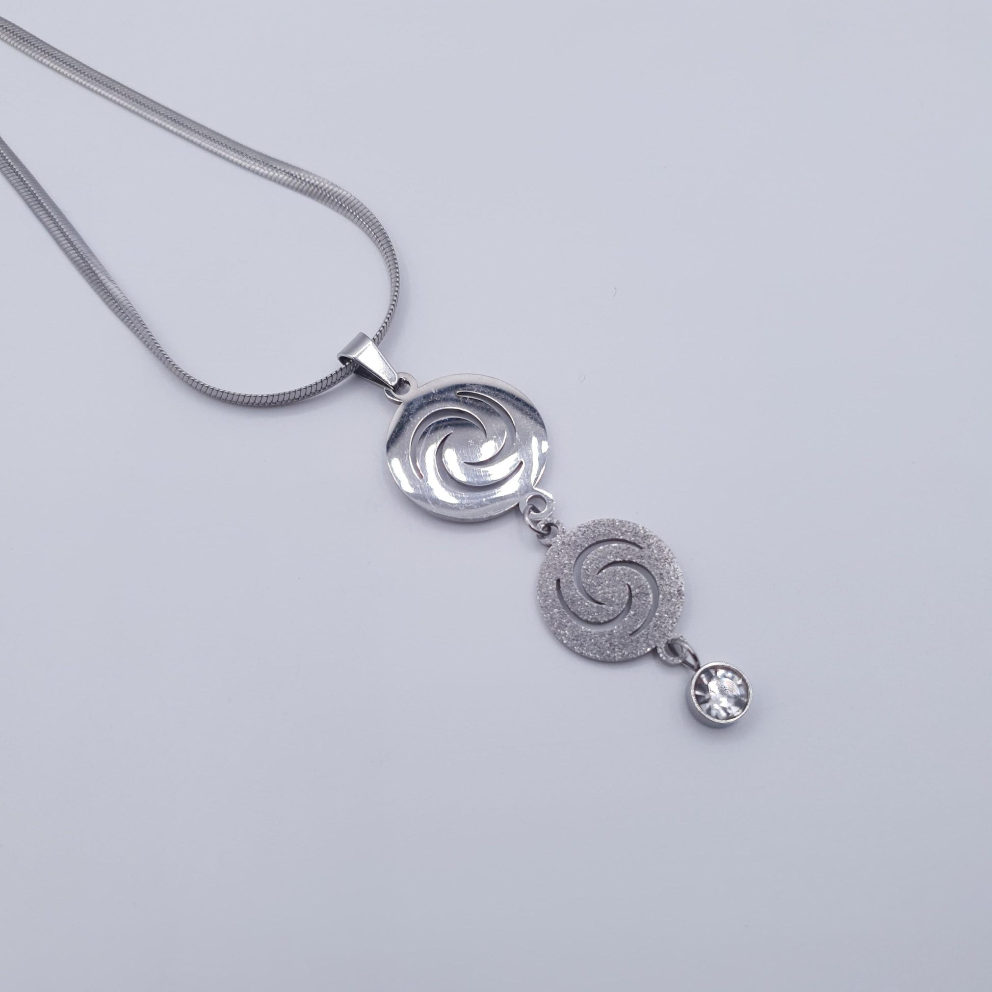 Elevate your look with this timeless spiral elegance Stainless Steel Neckace Set. image 1