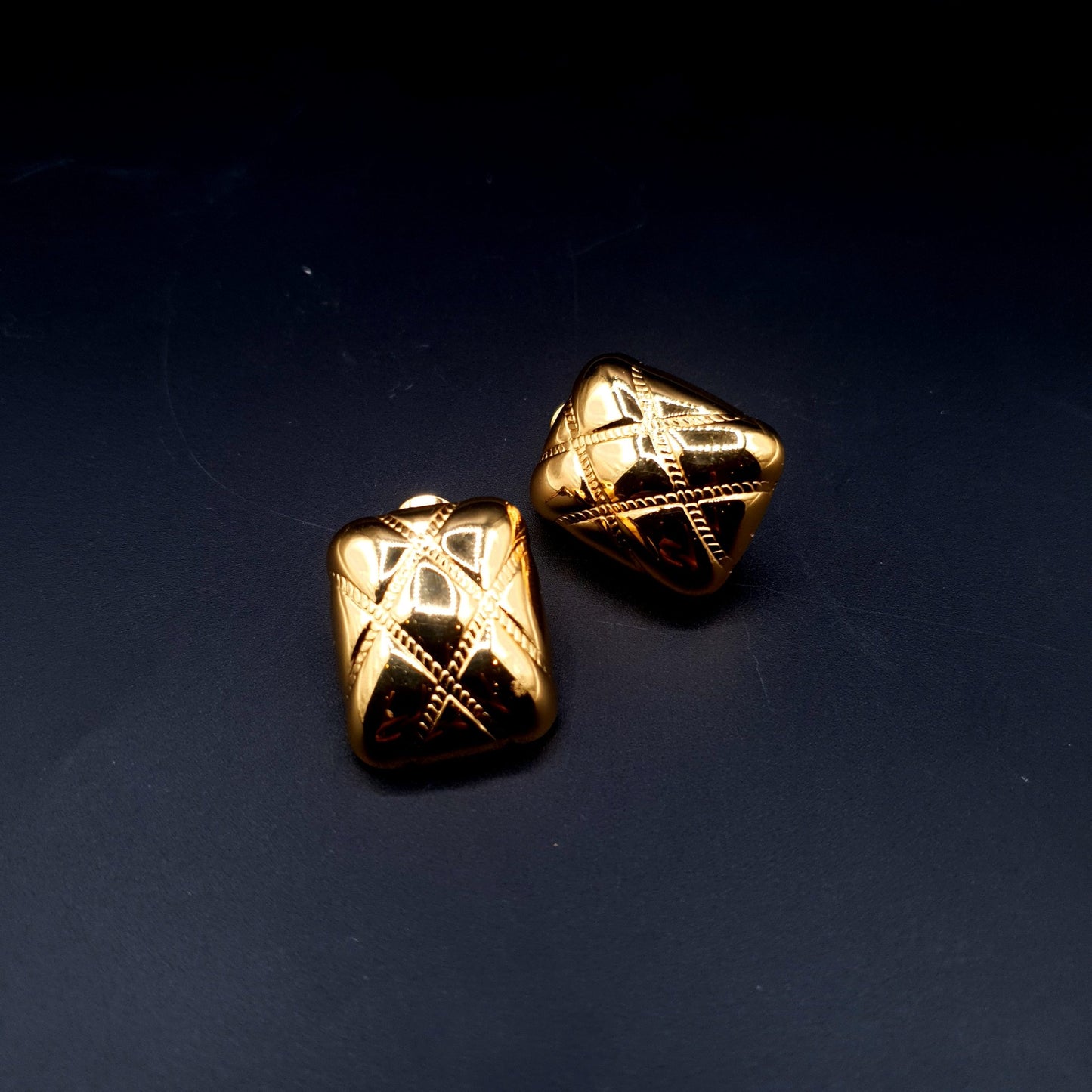 Sleek stainless steel square-shaped tops with a luxurious golden finish for a bold, modern look. image 0