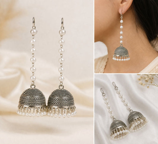 Elegant silver jhumka earrings with a pearl chain drop