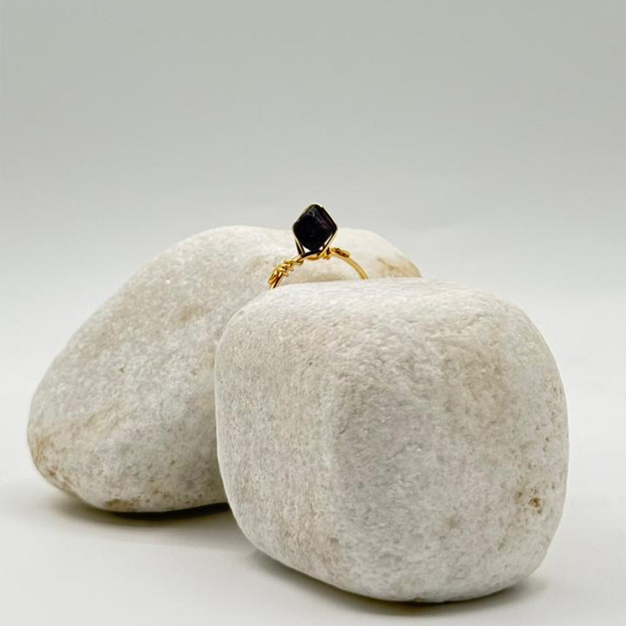 handcrafted gold ring with a deep black stone image 3
