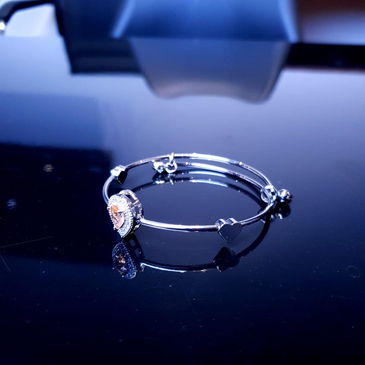 A delicate bracelet featuring a charming design accented with sparkling white stones. image 6