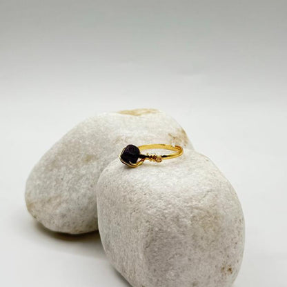handcrafted gold ring with a deep black stone image 1