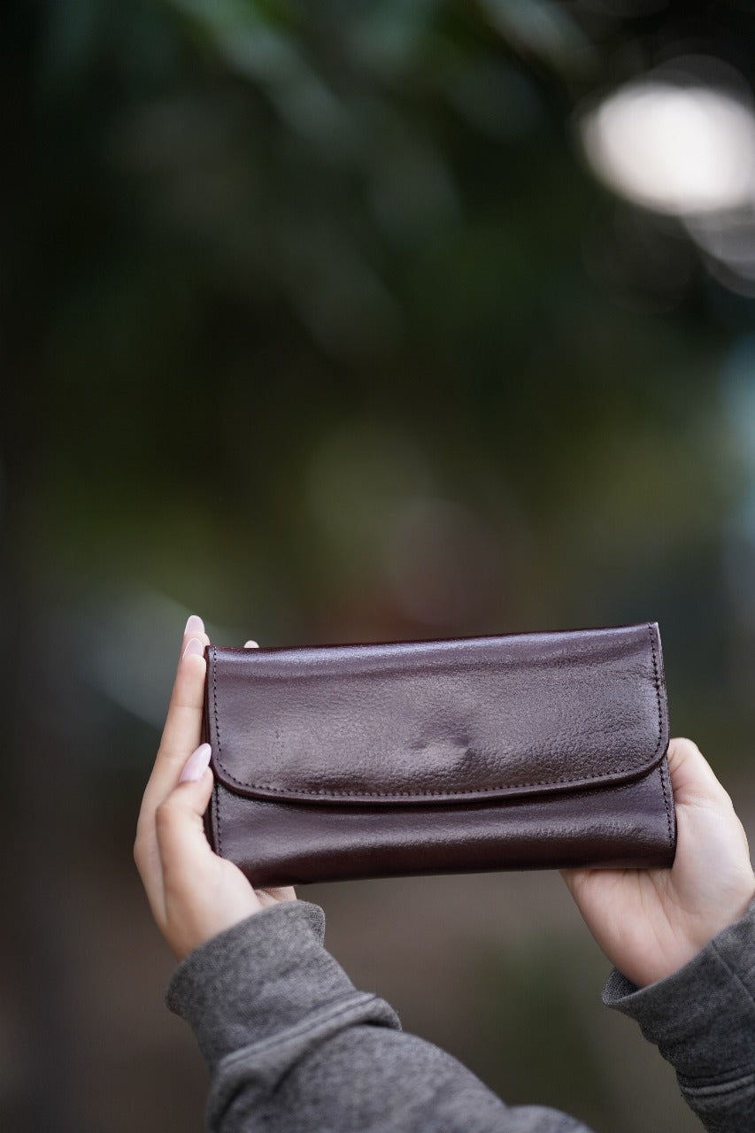 A Stylish and minimalistic genuine leather clutch with a smooth finish and curved flap design, perfect for any occasion image 8