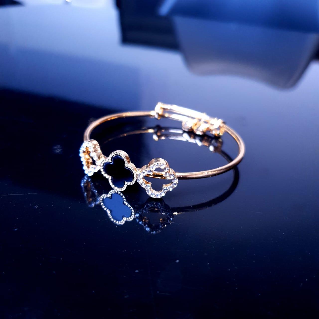 Golden Bracelet with Black Clover Charm image 0