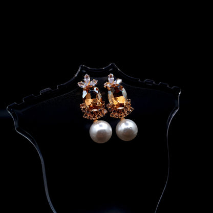 Stunning rhinestone earrings with a graceful drop-down pearl for a timeless and elegant charm.(Silver = 1, Champagne = 1) image 5