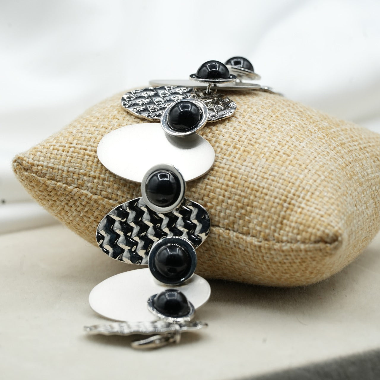 A contemporary mix of oval and circular metal elements in alternating textures image 3