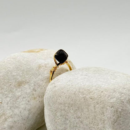 handcrafted gold ring with a deep black stone image 4
