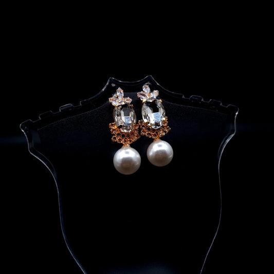 Stunning rhinestone earrings with a graceful drop-down pearl for a timeless and elegant charm.(Silver = 1, Champagne = 1) image 1