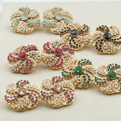 Likely gold-plated metal with a detailed filigree design image 0
