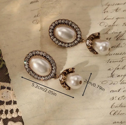 Fashionable, Romantic, Oval-Shaped Earrings Featuring Golden Plating And Embellished with Faux Pearls And Rhinestones image 0